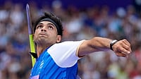 Doha Diamond League 2026: Neeraj Chopra Finishes Fourth, Meets CWG Mark As Pathirage Steals Javelin Title (AP Photo/Matthias Schrader) : Neeraj Chopra, of India, competes during the men's javelin throw qualification at the 2024 Summer Olympics, Tuesday, Aug. 6, 2024, in Saint-Denis, France.